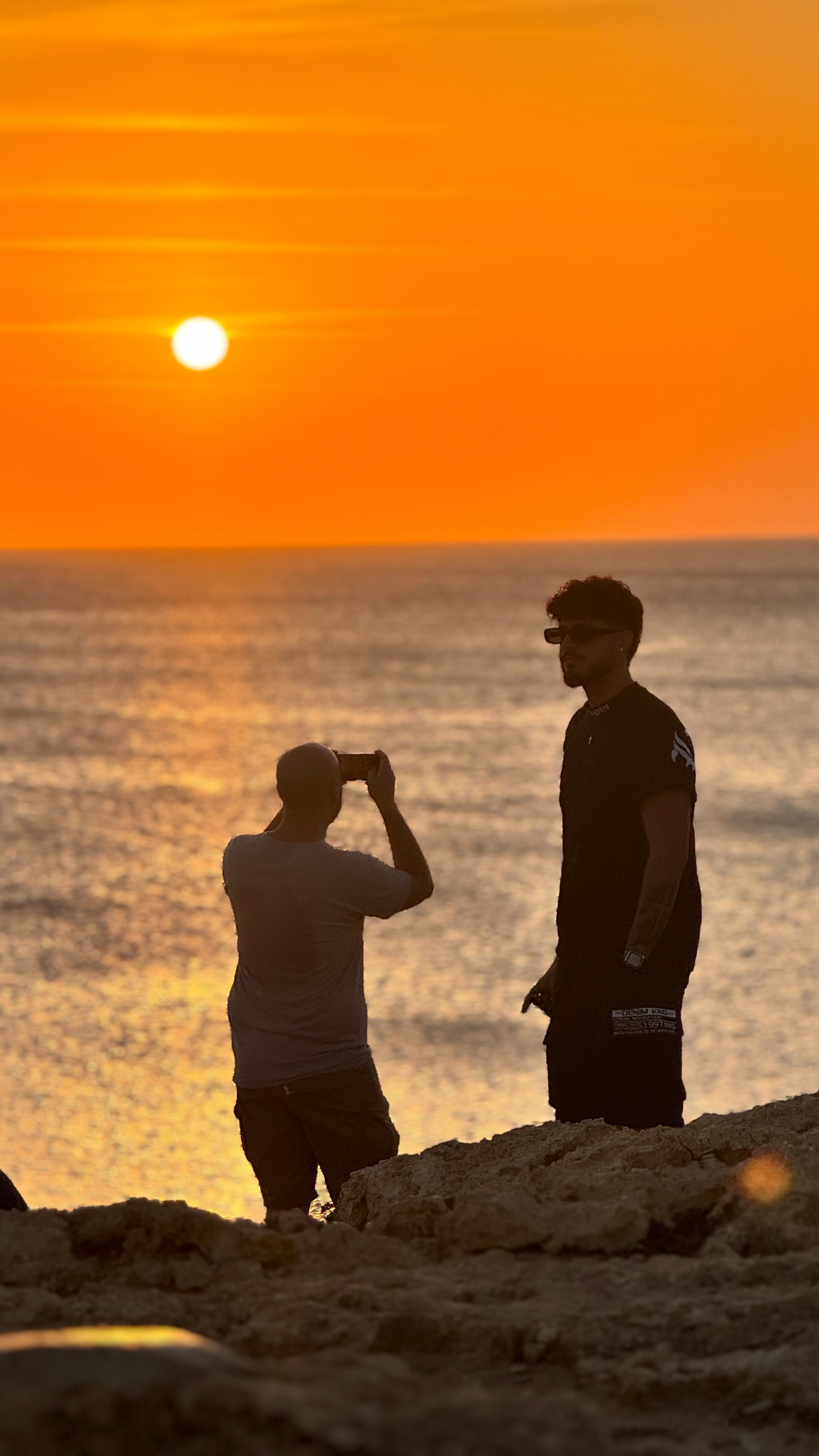 Erasmus+ participants at sunset by the sea