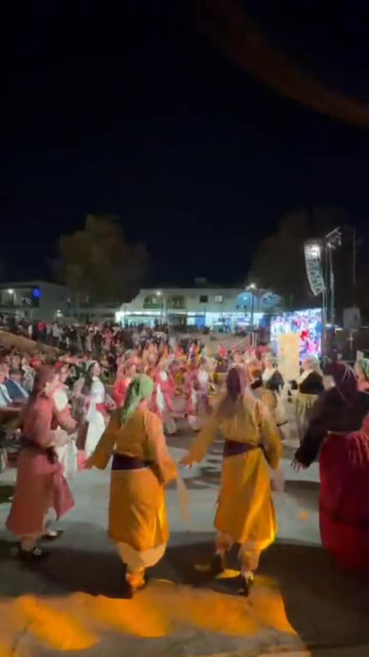Community circle dance reel at night